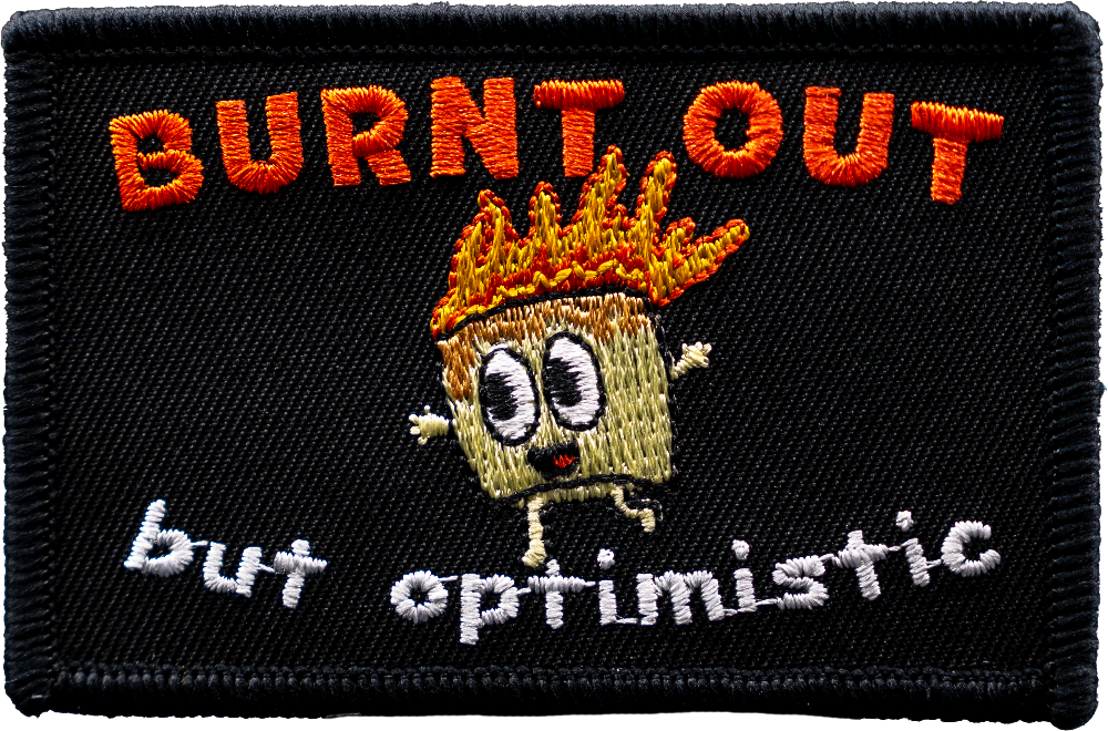Embroidered patch with cartoon character and text 'BURNT OUT but optimistic' on a black background