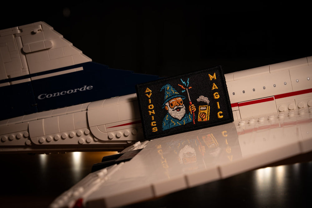 Model airplane with a 'Concorde' label and a Avionics Magic Patch on the wing