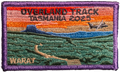 Embroidered patch with scenic design and text 'Overland Track Tasmania 2025' on a rectangular background.