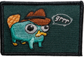 Embroidered patch of a cartoonish platypus with a cowboy hat on a green background