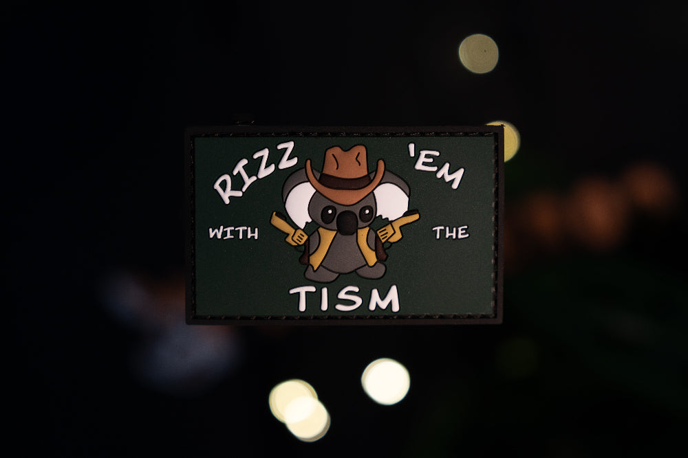 Patch with a cartoon koala wearing a cowboy hat and text on a dark background